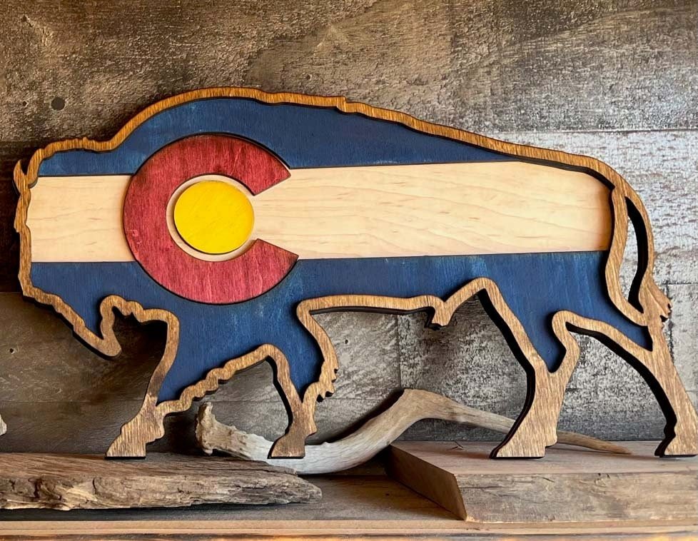 Handmade Colorado Buffalo flag layer by Bunkhouse Studio LLC, featuring vibrant colors and detailed buffalo design.