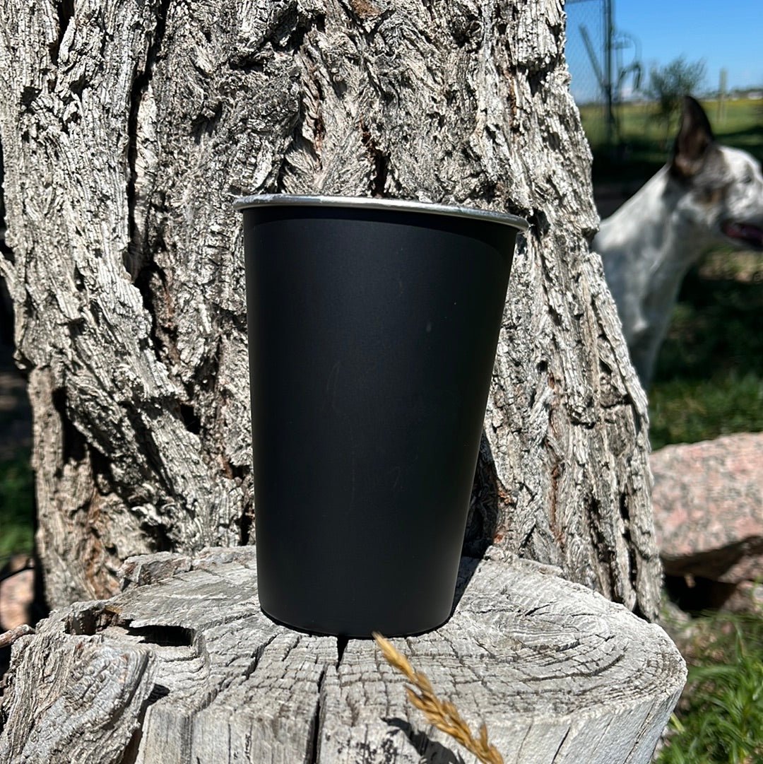 Engraved stainless steel cup with detailed design, showcasing a sleek, durable drinking vessel from Bunkhouse Studio LLC.