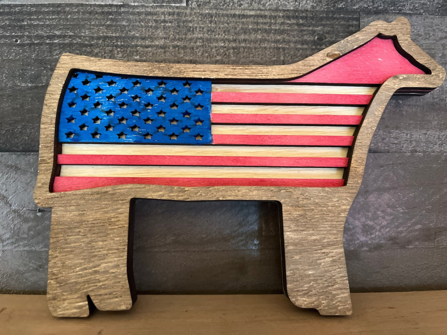 Handmade Heifer or Steer USA flag layered art by Bunkhouse Studio LLC, featuring detailed animal and patriotic flag design.