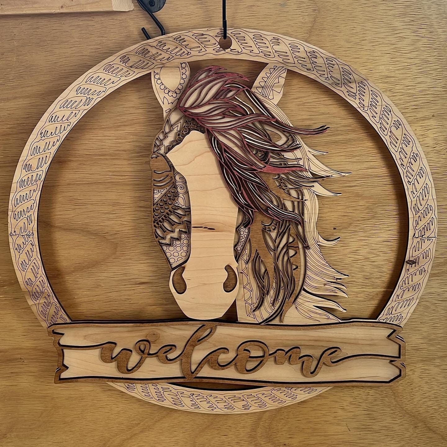 Western rustic horse head door hanger with distressed wood finish, featuring a detailed horse silhouette for farmhouse decor.