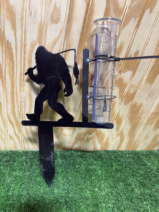 Bigfoot Sasquatch metal steel rain gauge with detailed Sasquatch figure and measurement markings for outdoor weather tracking.