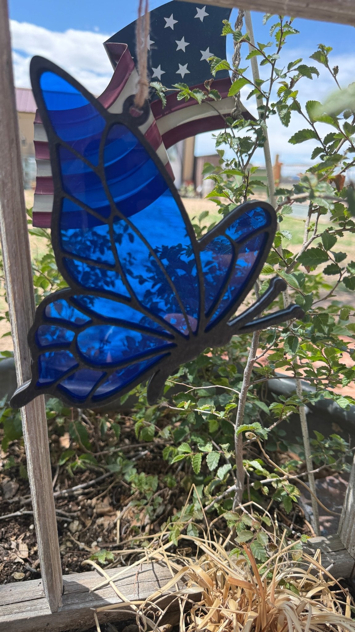 Rustic modern butterfly lover sun catcher window decor by Bunkhouse Studio LLC, featuring colorful butterfly design for window decoration.