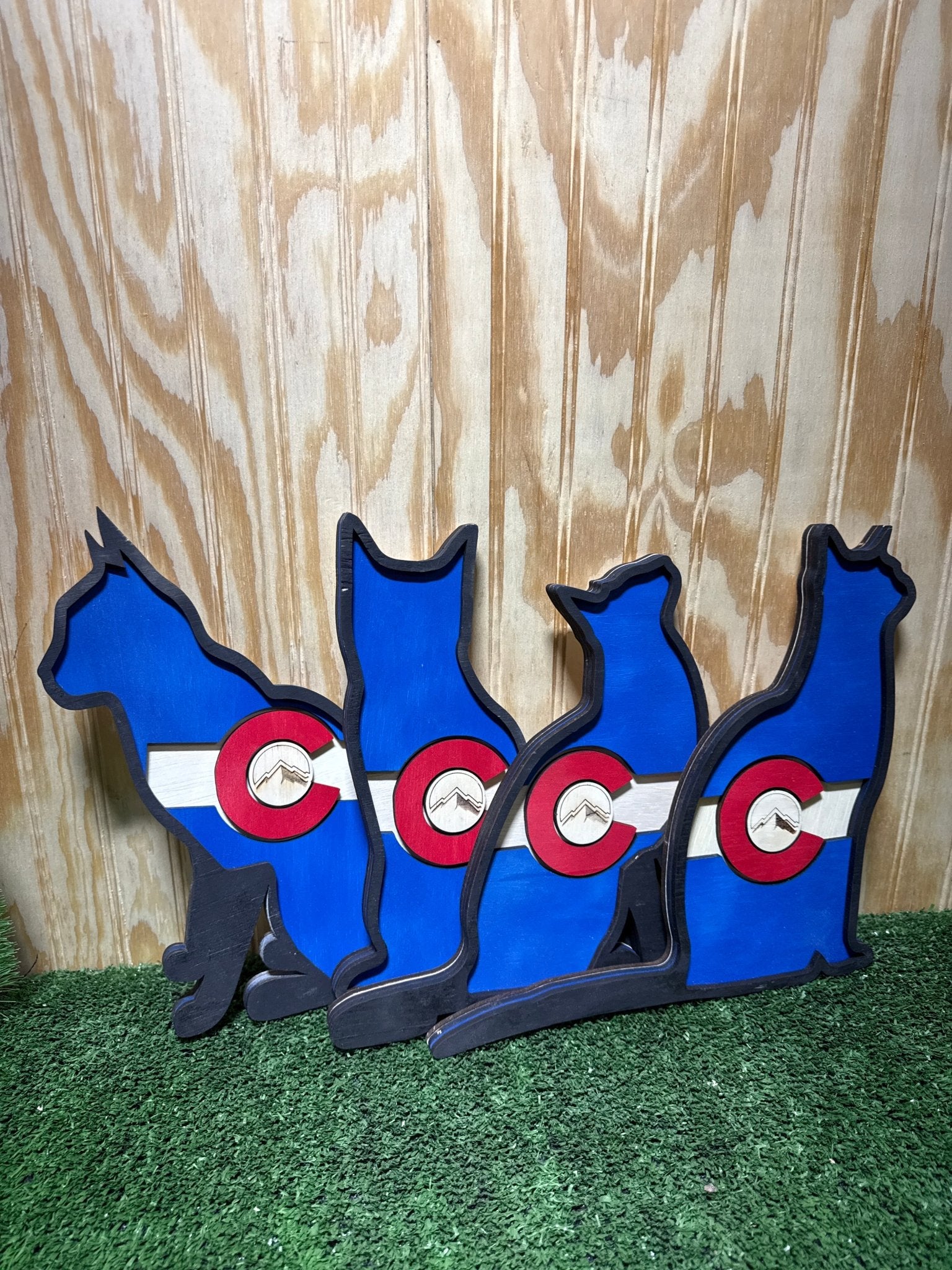 Colorful cat-shaped Colorado flag poster by Bunkhouse Studio LLC featuring vibrant red, blue, and white design elements.