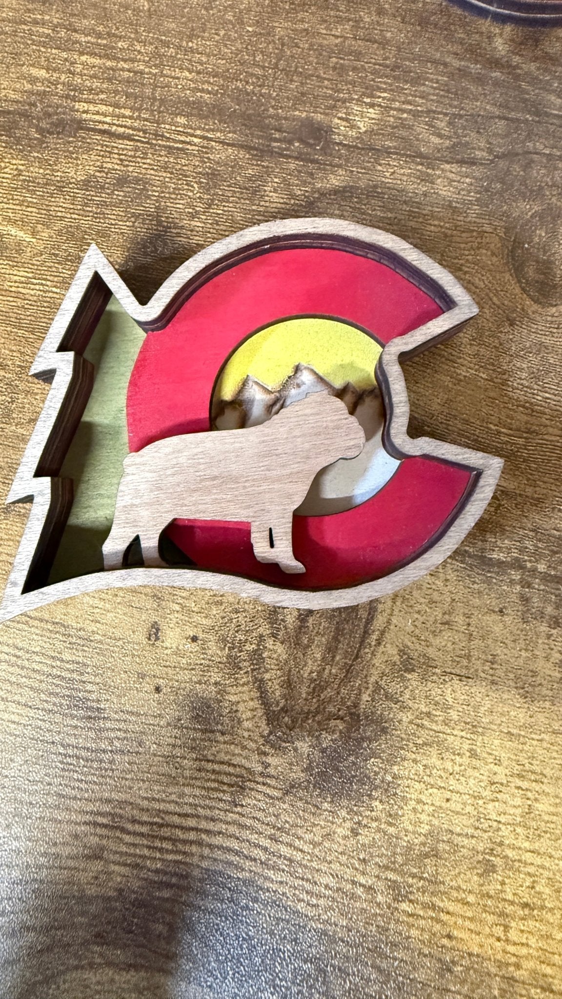 Colorado Dog Shelf Sitter figure by Bunkhouse Studio LLC, a cute painted wooden ornament of a dog for shelf decoration.