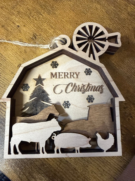 Rustic farm barn ornament by Bunkhouse Studio LLC, featuring detailed miniature wooden barn with weathered finish and festive charm.