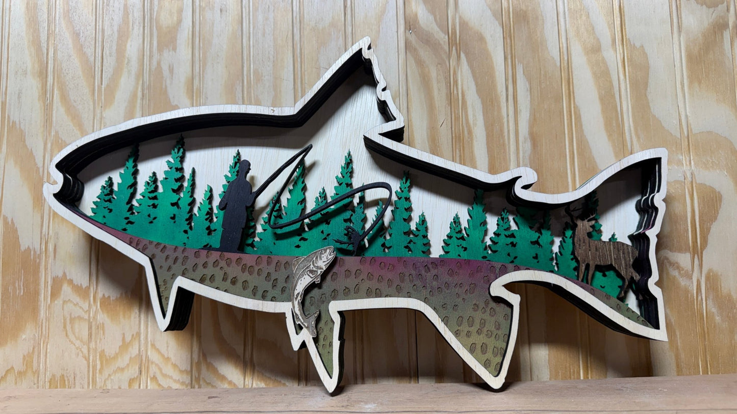 Handcrafted wooden trout wall art by Bunkhouse Studio, featuring a fly fisherman scene for rustic cabin or lodge decor.