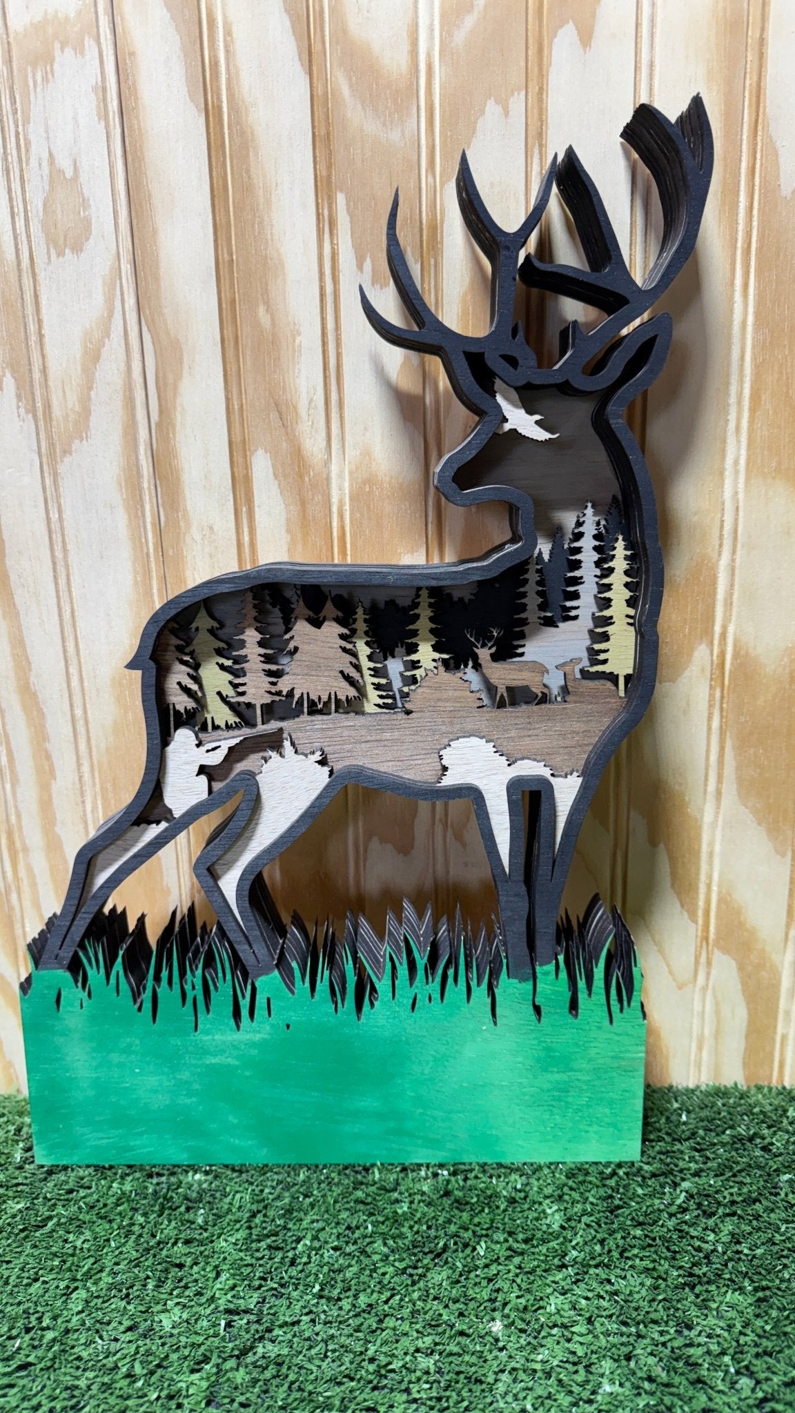 Layered Deer Hunter kneeling figure by Bunkhouse Studio LLC, detailed layered animal art for crafts or decor.