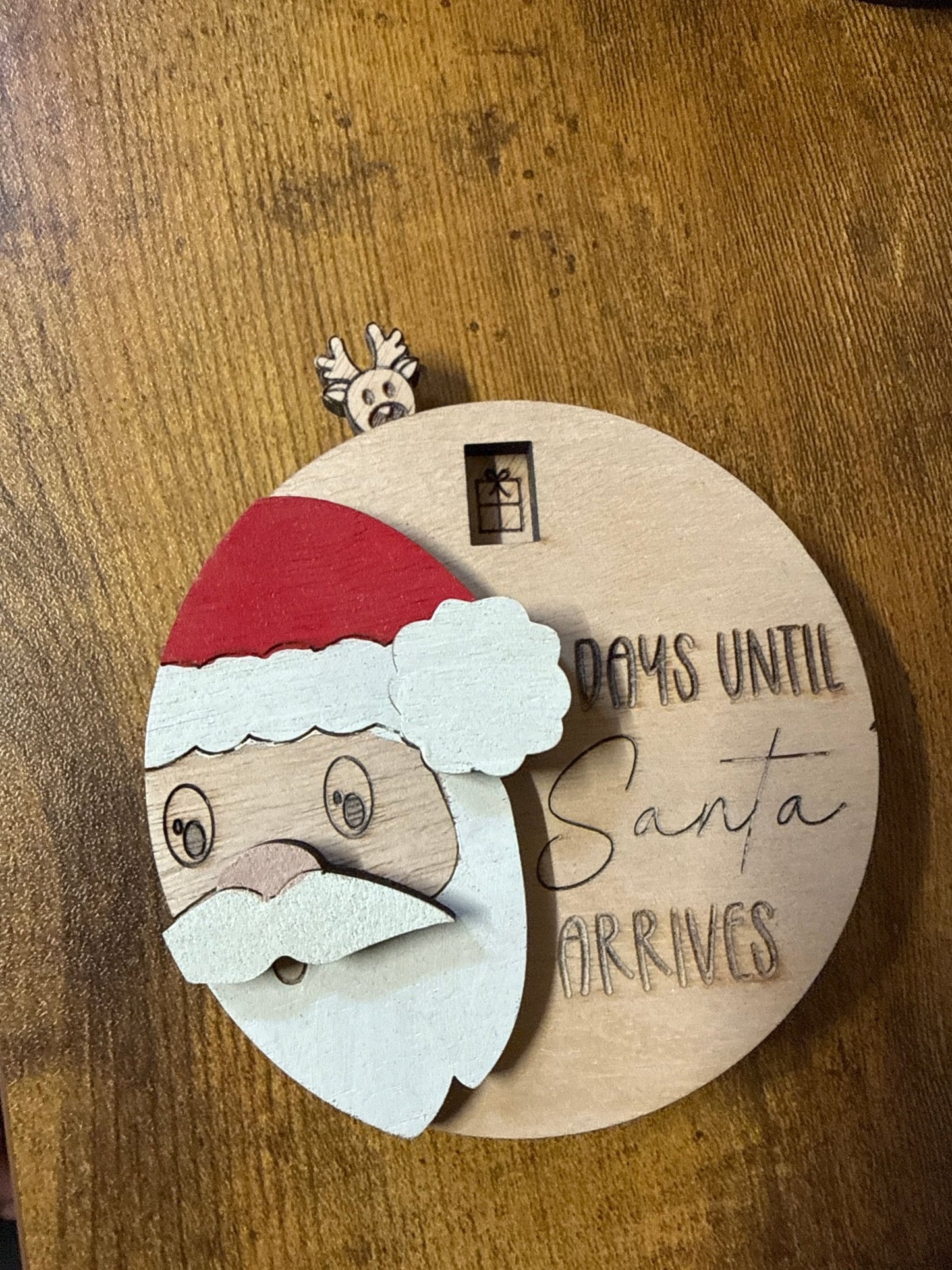 Santa countdown to Christmas display by Bunkhouse Studio LLC showing festive holiday number markers and Santa figure.