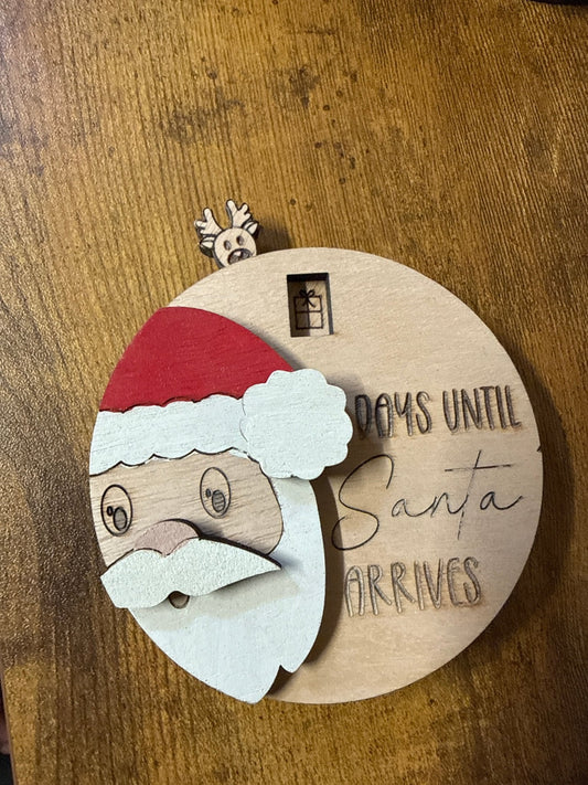 Santa countdown to Christmas display by Bunkhouse Studio LLC showing festive holiday number markers and Santa figure.
