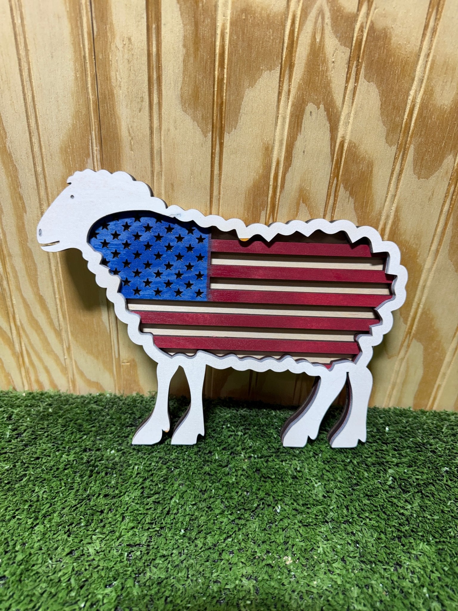 American flag featuring a sheep design, representing the Sheep USA Flag by Bunkhouse Studio LLC.