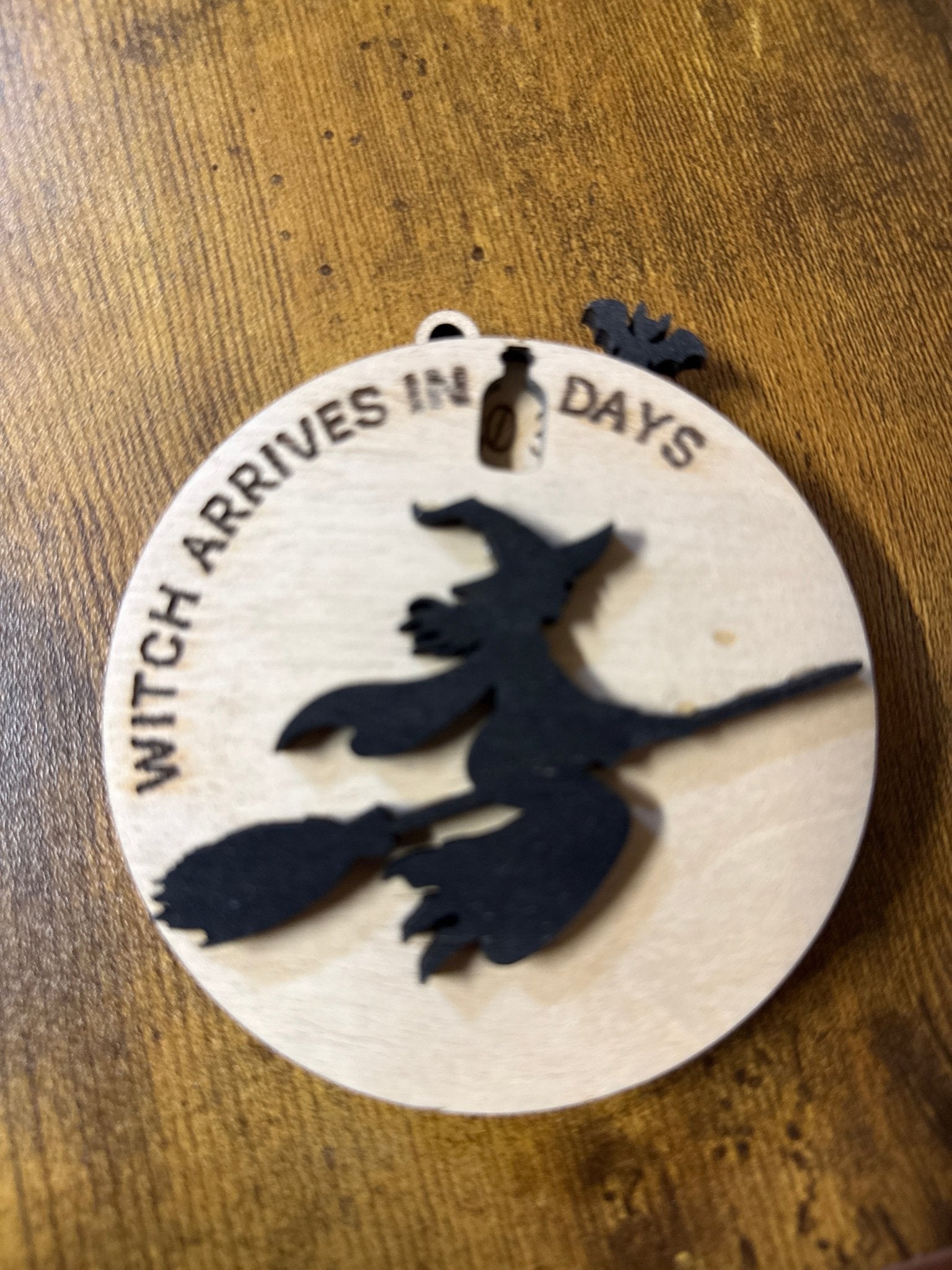 Halloween witch countdown timer by Bunkhouse Studio LLC, featuring a spooky witch design on a decorative countdown display.