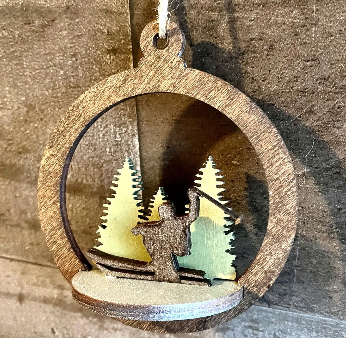 Two-layer circular ornament by Bunkhouse Studio LLC with intricate cutout design, perfect for holiday or decorative display.