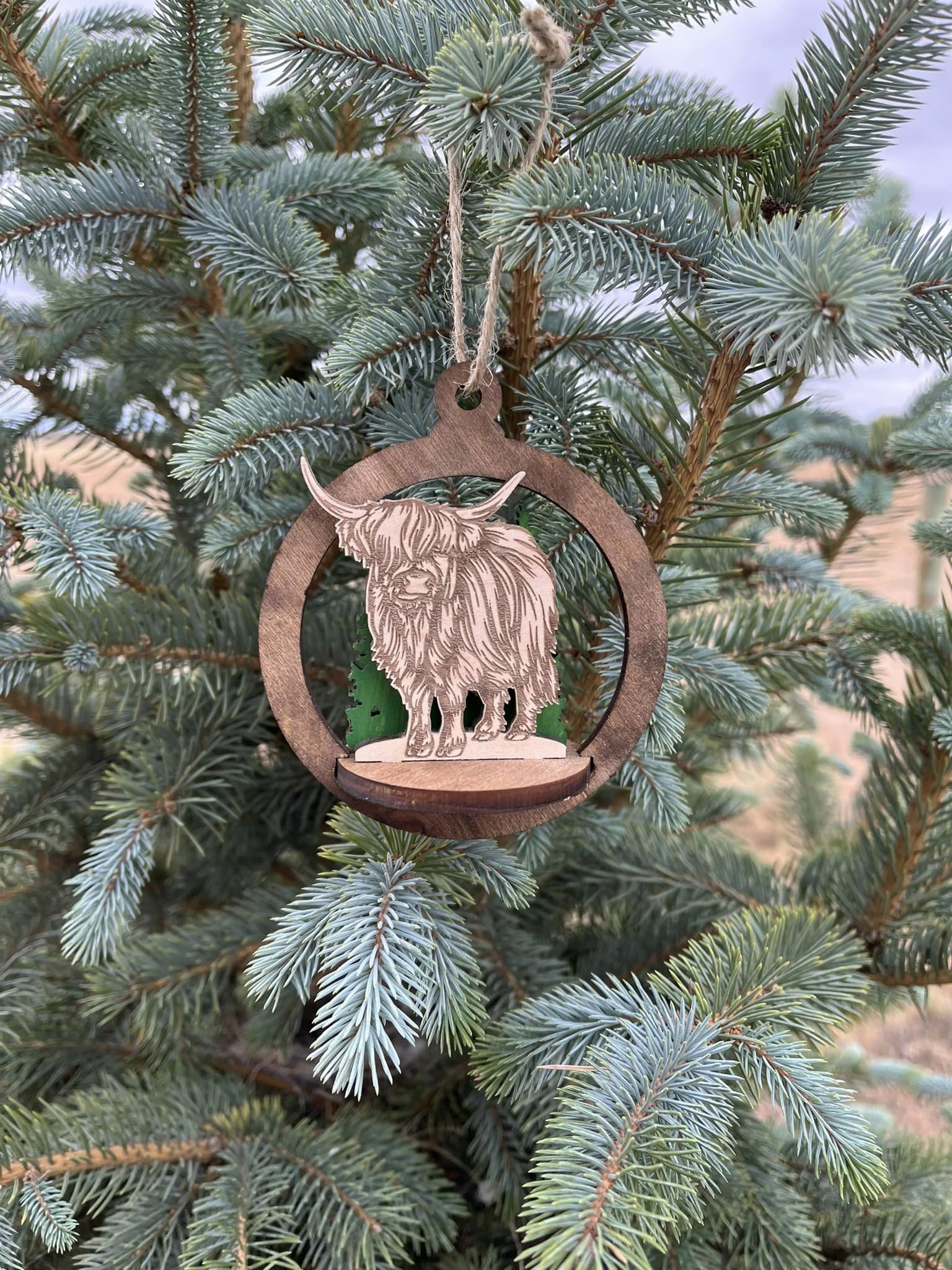Two-layer circular ornament from Bunkhouse Studio LLC with intricate cutout design, perfect for holiday or decorative use.
