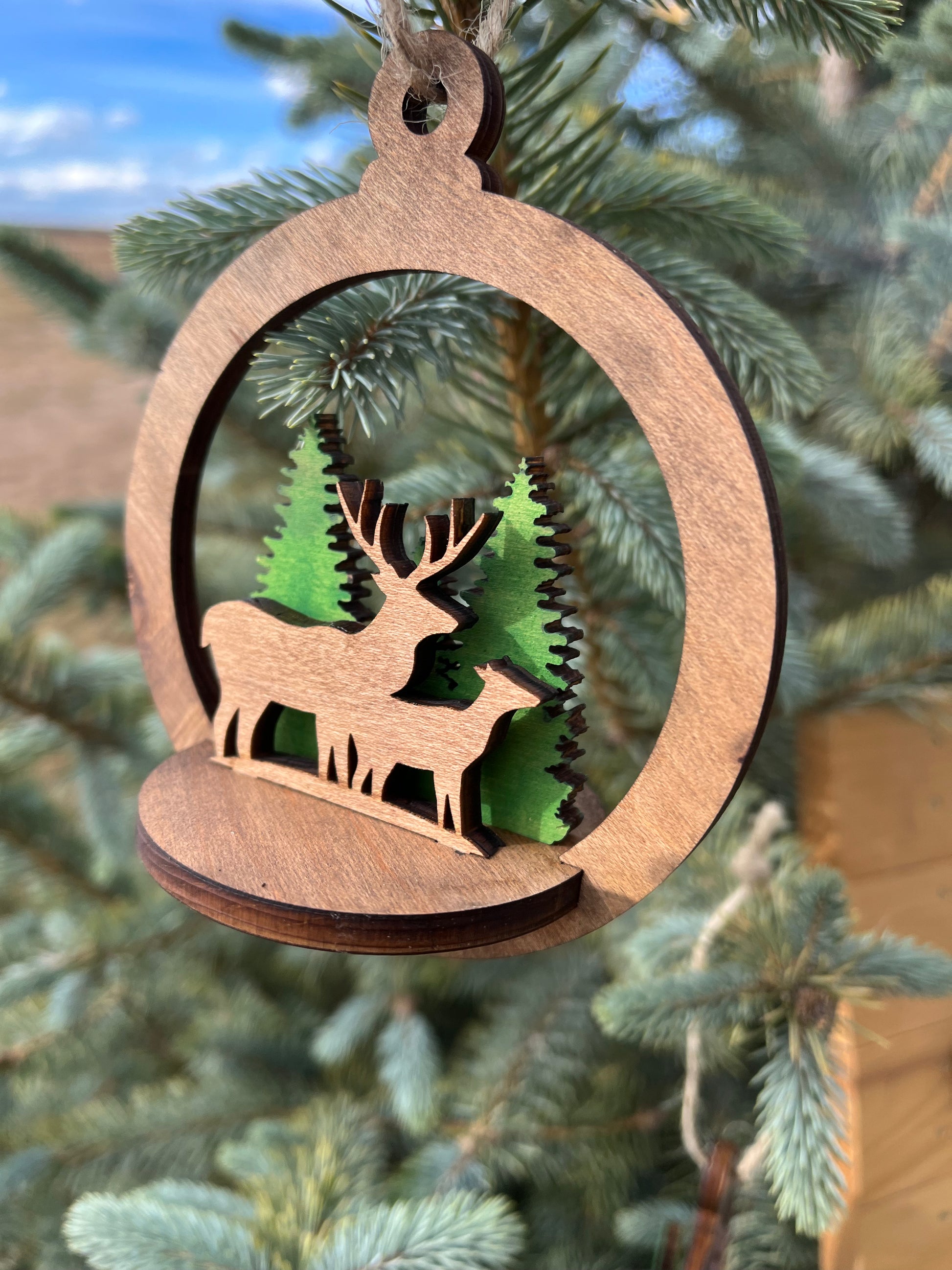Two-layer circle ornament by Bunkhouse Studio LLC featuring intricate wooden design and smooth finish.