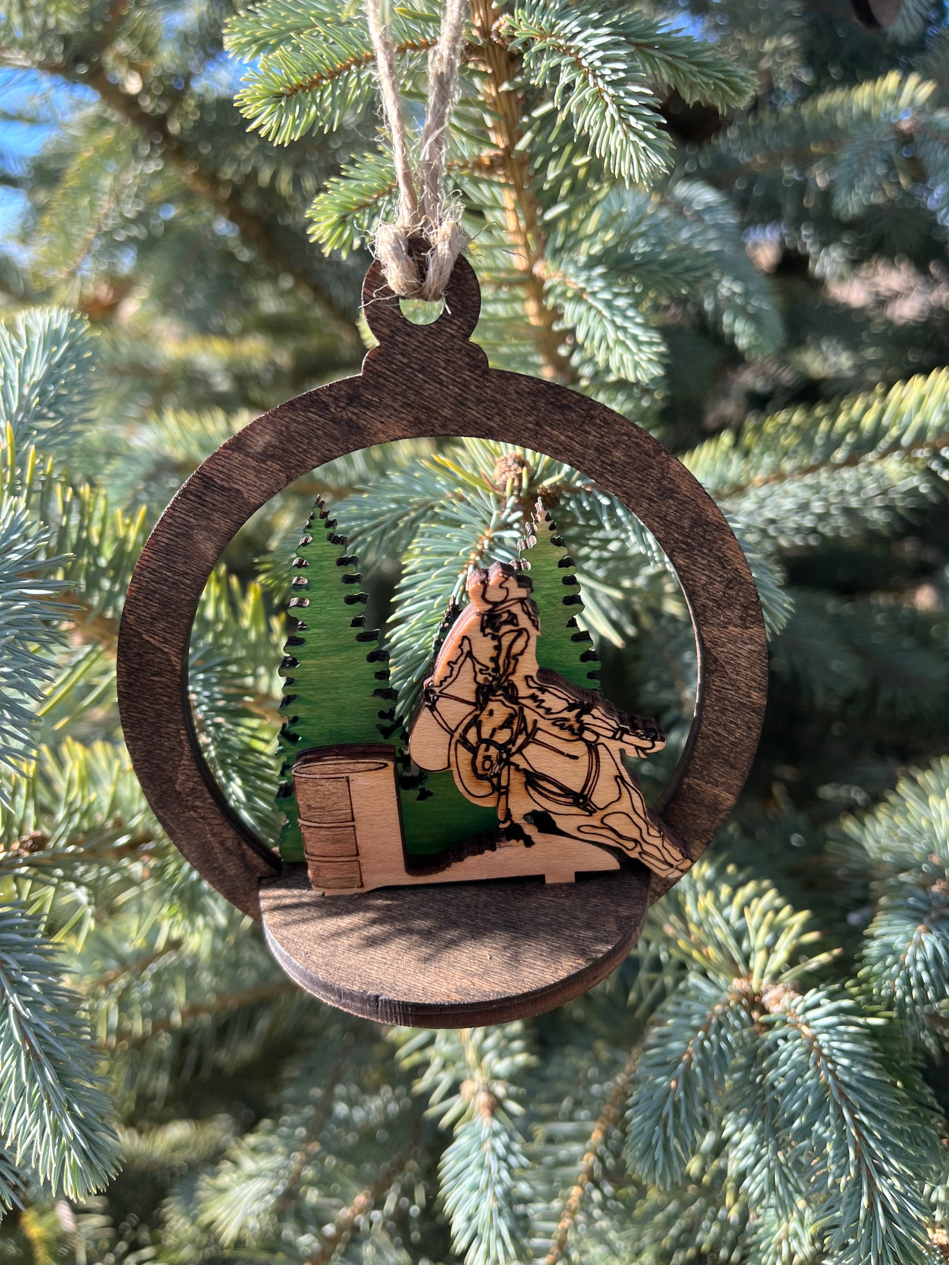 Two-layer round ornament by Bunkhouse Studio LLC featuring intricate circular designs on a white background.
