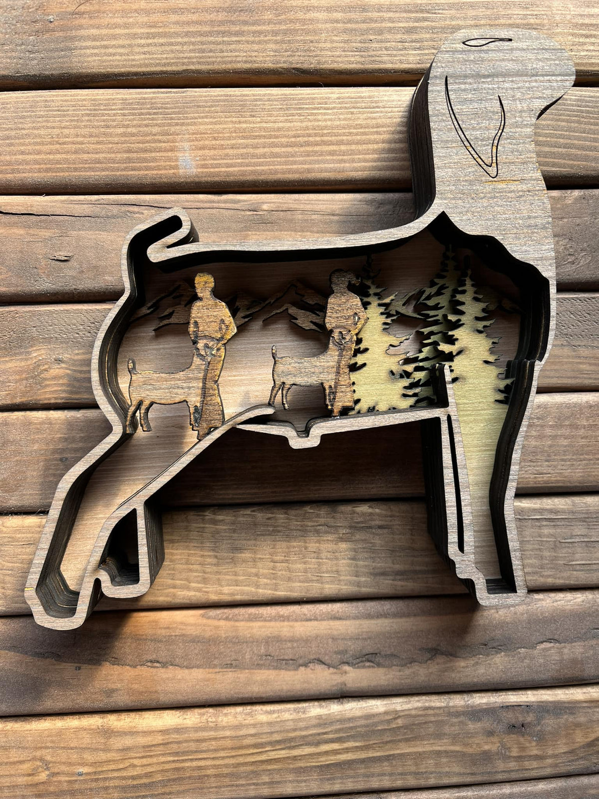 Show goat (doe) from Bunkhouse Studio LLC, with distinctive coat and alert posture, ready for custom order.
